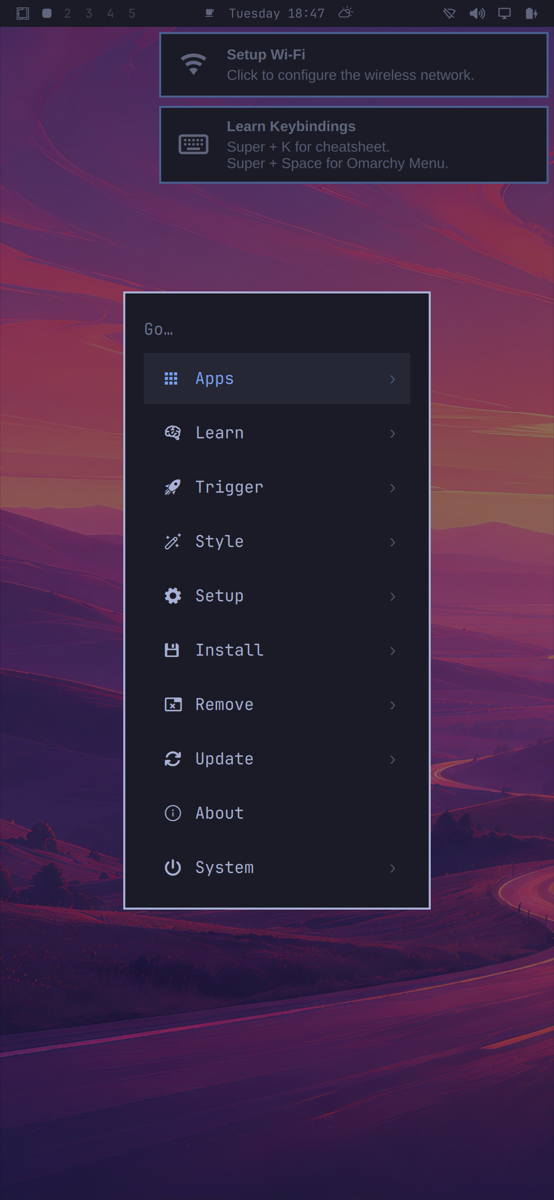 The Omarchy menu open on the phone: Apps, Learn, Trigger, Style, Setup, Install, Remove, Update, About, System